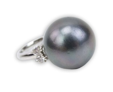 17mm Tahitian Black Pearl, .36 Carat Round Brilliant Cut Diamond and Platinum Ring. Signed Pt900. Very good condition. Ring s