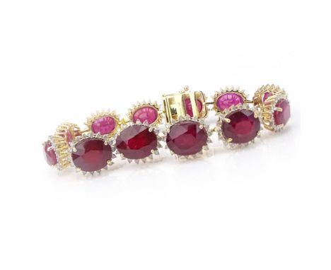 AIG Certified 64.65 Carat Oval Cut Ruby, 2.61 Carat Round Brilliant Cut Diamond and 14 Karat yellow Gold Bracelet. Rubies wit