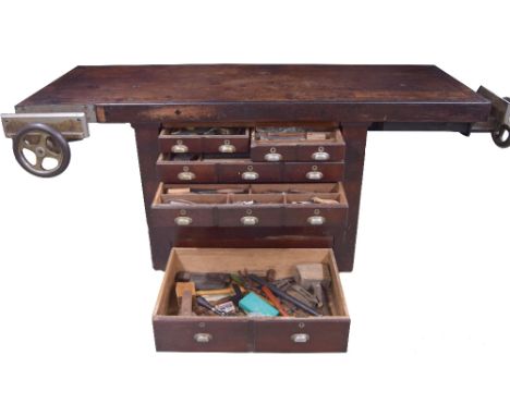 Arnold Dolmetsch's work bench, French, 19th century, of mahogany with four drawers with cup handles, two vices, one to the fr
