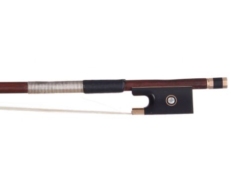 German gold mounted violin bow by and faintly stamped K.W. Uebel, the stick octagonal, the ebony frog inlaid with gold rings 