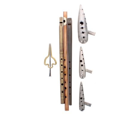 Set of three Charles Mathieu metal ocarinas; together with two penny whistles, a copper flute and a Jews harp (7)