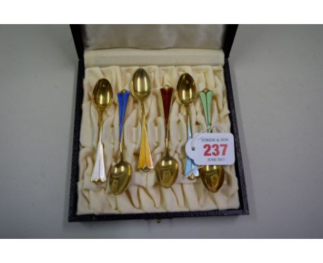 A cased set of Norwegian silver gilt and enamel coffee spoons. by David Andersen.   Condition Report:  Good overall.  Minor d