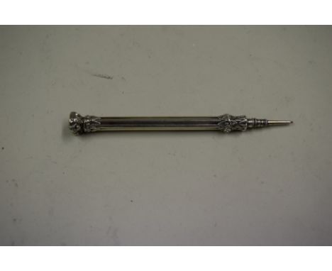 A Victorian ornate silver propelling pencil, by S Mordan & Co, the finial set purple coloured gem intaglio decorated initial 