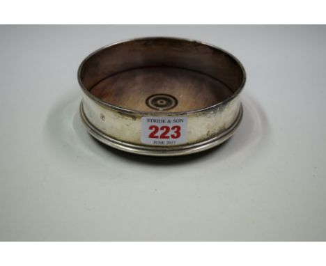A silver mounted coaster, by C S R Ltd, London 1985, 12.5cm.