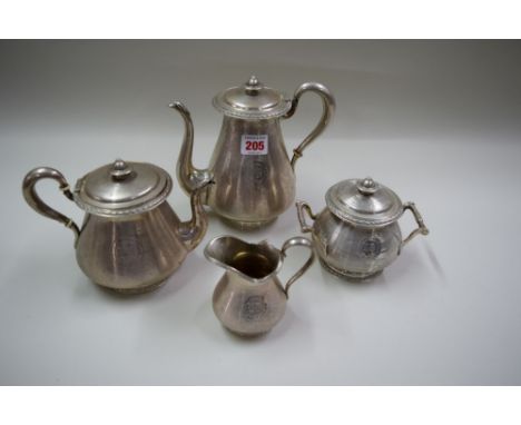 A Continental metal four piece tea set, possibly Flemish, having engine turned decoration, the lidded sugar bowl stamped 900.