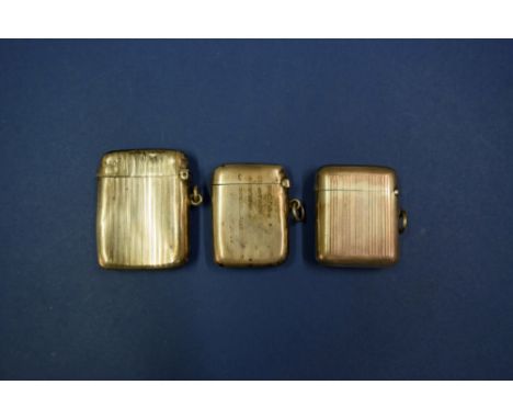 Three engine turned silver vesta cases.