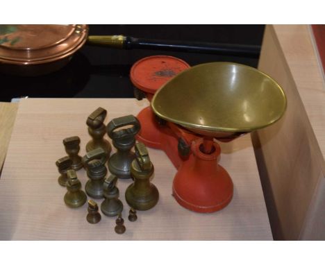 A set of cast iron kitchen scales and weight