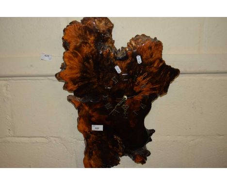 A hardwood wall clock