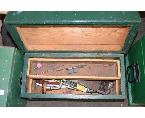 A wooden tool box and assorted contents