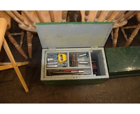 A wooden tool box and assorted contents