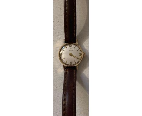 UNMARKED YELLOW METAL TISSOT WATCH

IN WORKING ORDER 
