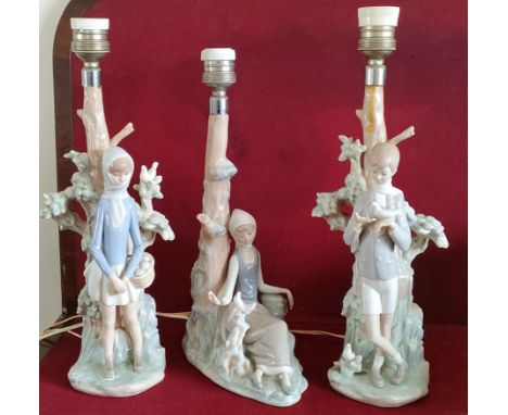 THREE VARIOUS GLAZED CERAMIC LLADRO TABLE LAMPS, DECORATED WITH FIGURES AND FOLIAGE

ALL IN USED CONDITION, UNCHECKED 