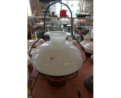 A 20th Century metal framed hanging oil lamp with milk glass shade.