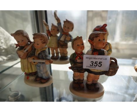 Four Goebal Hummel figurines to include a large example depicting a girl reading.