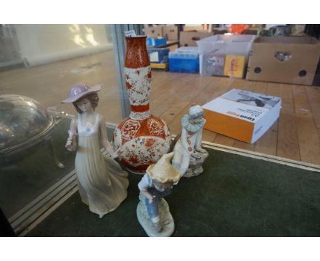 Three assorted Nao figurines depicting seated Jester, also a Katani vase.