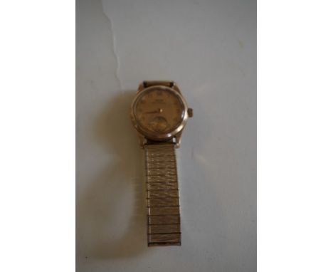 Tissot: A Gents manual wind wristwatchWith gold back (unmarked), and subsidiary seconds dial, to flexi strap 
