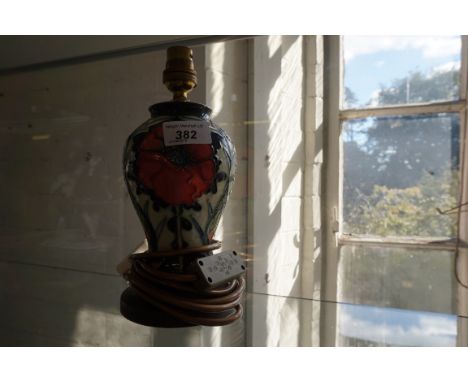 A modern Moorcroft table lamp decorated in the Anemone pattern.