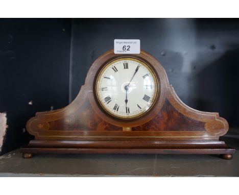 An Edwardian burr walnut and mahogany mantel clock.