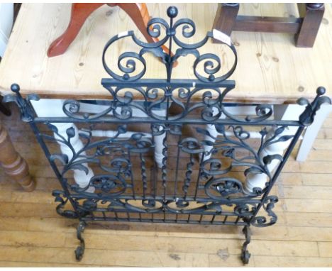 A good quality wrought iron fire screen having pierced decoration.