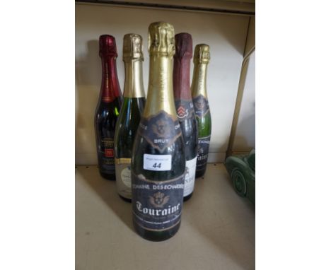 Five bottles of assorted sparkling wine. 