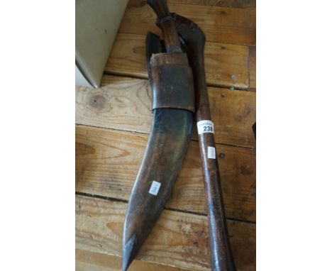 A vintage Kukri knife together with a brass applied club. CONDITION REPORT: Handle is solid