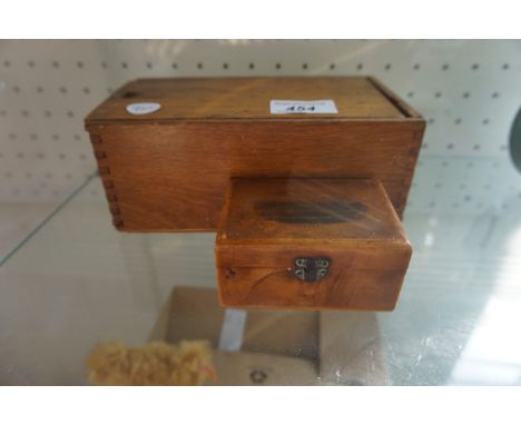 A vintage wooden chess set and Mauchline ware lidded box depicting a Chester scene.
