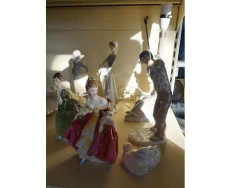 Three Lladro figurines to include a table lamp and Nao model of two ducks, two dolphins figurines, HN2229 Southern Belle, and