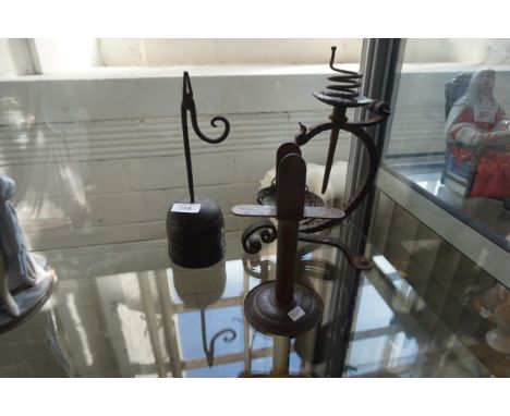 A vintage rush lighter together with an unusual candle holder, etc.