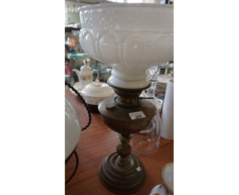 20th Century brass oil lamp with milk glass shade.