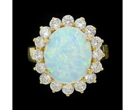18ct gold opal and round brilliant cut diamond cluster ring, stamped, total diamond weight approx 0.95 caratCondition Report: