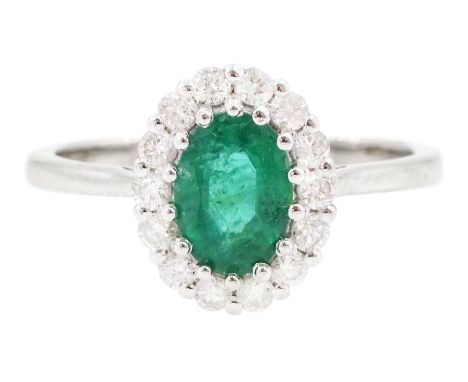 18ct white gold oval cut emerald and round brilliant cut diamond cluster ring, emerald approx 0.85 carat, total diamond weigh