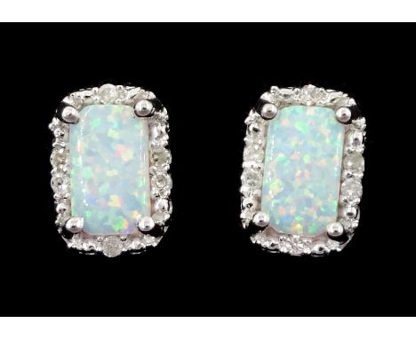 Pair of 9ct white gold opal and diamond stud earrings, stamped 375Condition Report:Approx 1.15gm, overall head = 6.5mm x 4.5m
