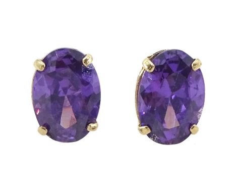 Pair of 9ct gold oval cut amethyst stud earrings, stampedCondition Report:Approx 0.8gm, head = 7mm x 5mm