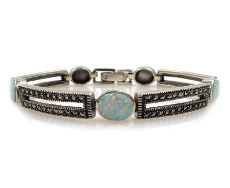 Silver opal and marcasite link bracelet, stamped 925Condition Report:Length = 19cm, link depth = 0.75cm, good condition