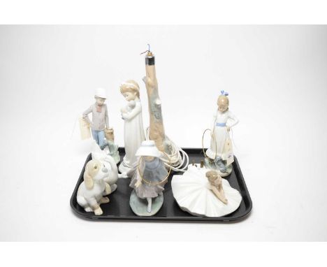 A collection of Nao ceramic figures, including: child with doll figurative table lamp, 35cms high; two children with hula hoo