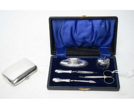 An early 20th Century silver cigarette case, by Charles S Green &amp; Co Ltd, 1915; together with a silver manicure set, by H