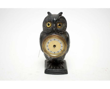 A 1930s owl miniature mantel clock, formed as an owl, with bead eyes, with faint presentation inscription ‘To Brown Owl, from