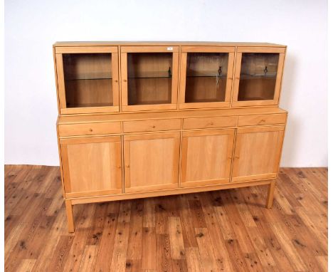 A retro-style Danish glazed teak sideboard by Rimme Designs, the glazed cabinet opening to reveal glass shelves, over a run o