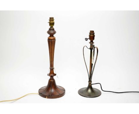 An Art Nouveau style bronzed copper table lamp, wired for electricity, 39cms high; together with a stained wood style table l