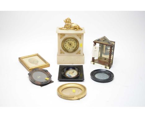 A gilt mounted onyx mantle clock, with gilt lion mount, 29cms high; together with a mirrored turned wood display stand; frame