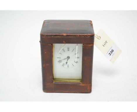 A 19th Century brass cased carriage clock, Roman dial, with platform lever escapement, 15cms high (including handle), in leat