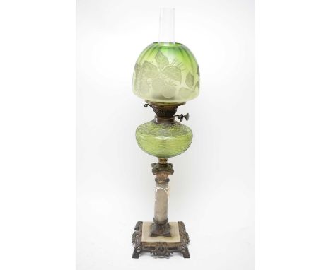 A Victorian brass and alabaster oil lamp, with green glass reservoir and shade, clear funnel, 70cms high.