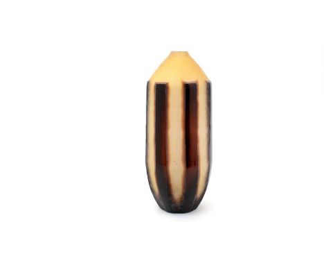 A contemporary art glass vase of cucumber form, overlaid in brown, cut and etched back to reveal vertical stripes, 40cms high
