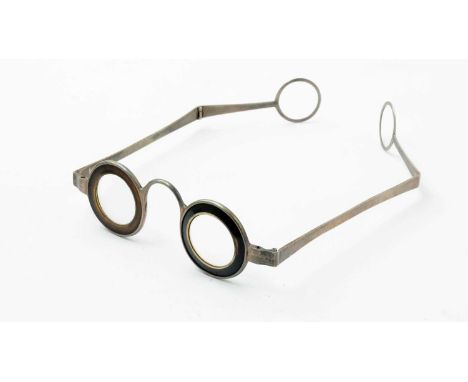 A pair of late 18th Century silver Martin's Margins eyeglasses or spectacles, with roundel ends and horn rims.Note: Benjamin 