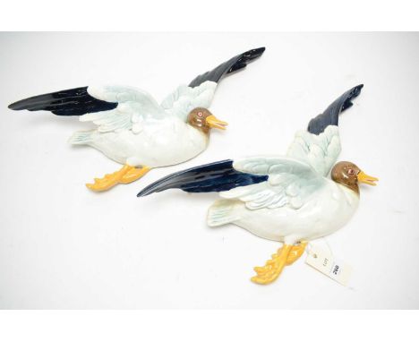 A pair of Art Deco style seagull ceramic wall pockets, modelled in flight, 55cms wide (across the wings), made in Czechoslova