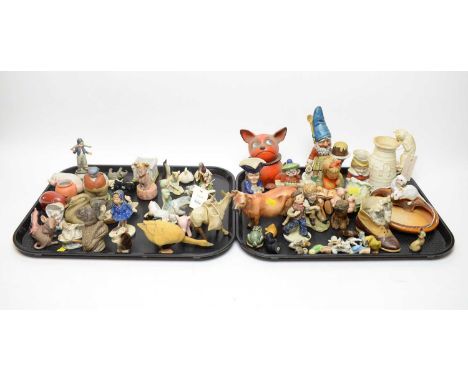 An assorted selection of decorative ceramic figures, including: Hummel figure of a girl reading; two smaller Hummel figures; 