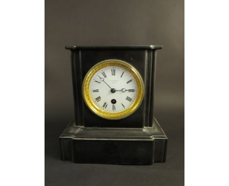 A Victorian slate mantel clock, Roman numerated dial with decorative brass bezel