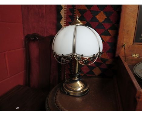 A touch brass table lamp with frosted glass panel shade in the form of a flower 