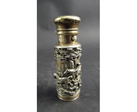 A late 19th early 20th Century unmarked white metal scent bottle with vinaigrette base, high relief hunting frieze to body, 8