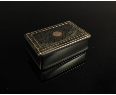 A tortoiseshell snuff box of rectangular form with gold piqué border and central vacant cartouche 
 